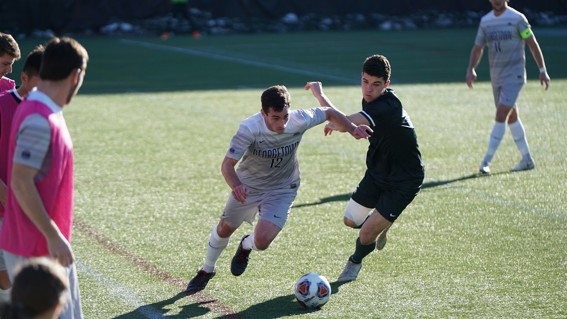 Older players running drills at full speed